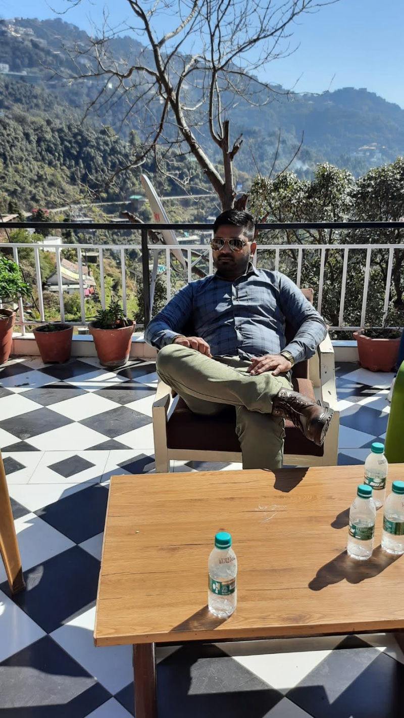 Sushil Singh - Scenic overlook in blue shirt
